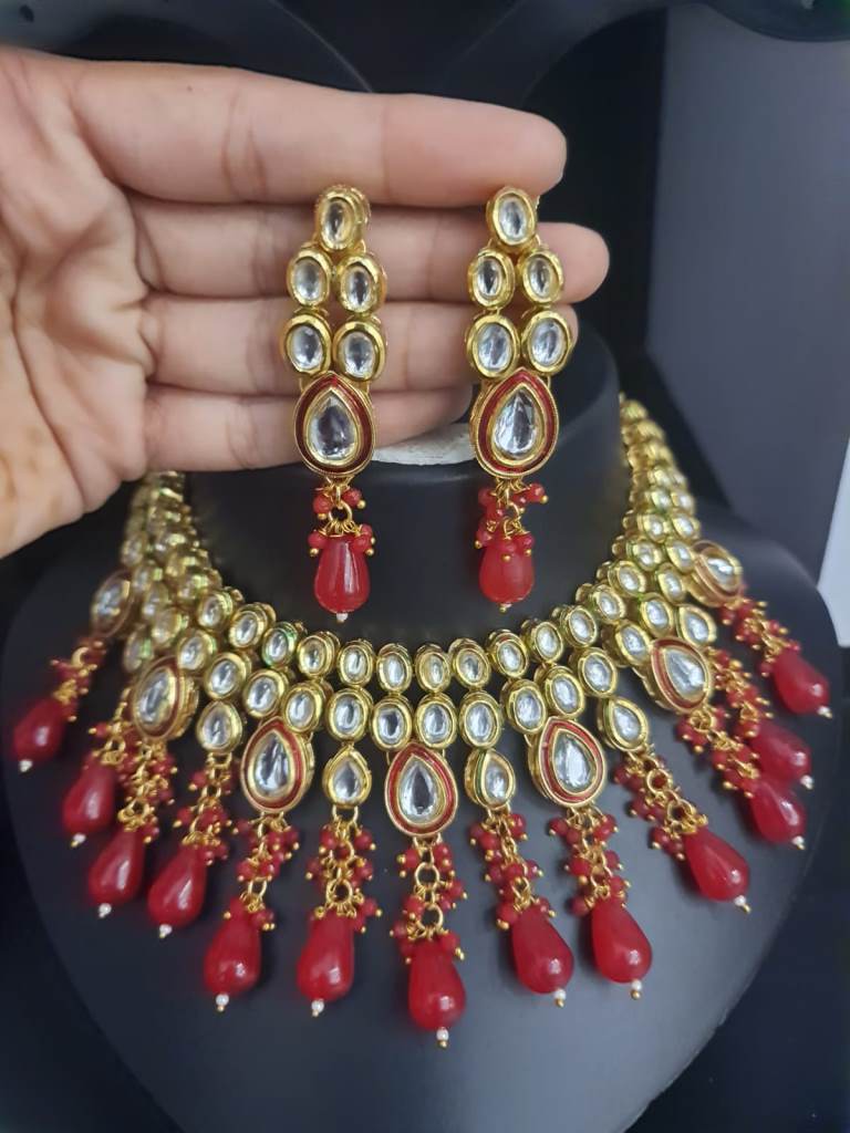 Uncut Kundan Necklace Set In White Stone And Red Moti.