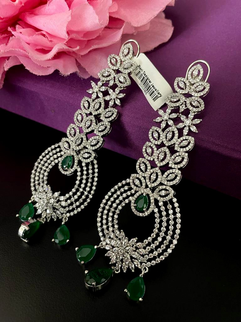 Rhodium Plated In Green Stone Earrings.