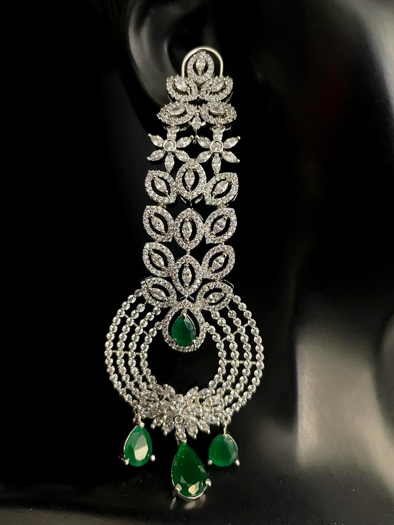 Rhodium Plated In Green Stone Earrings.