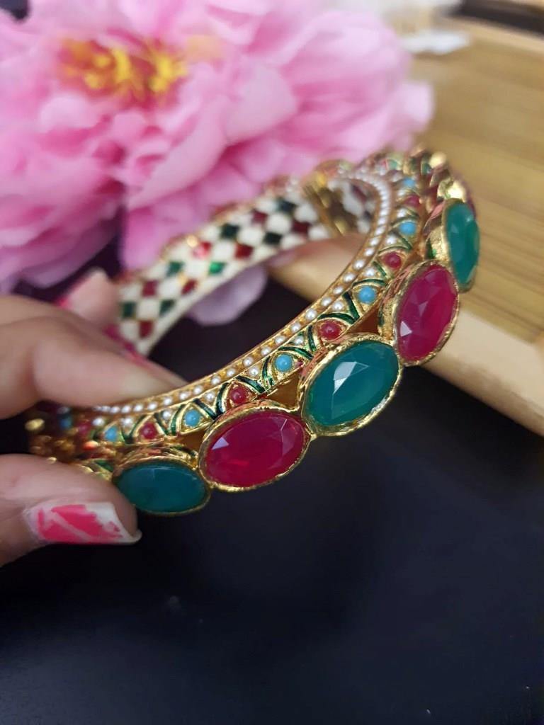 Gold Plated With Green And Ruby Stones.