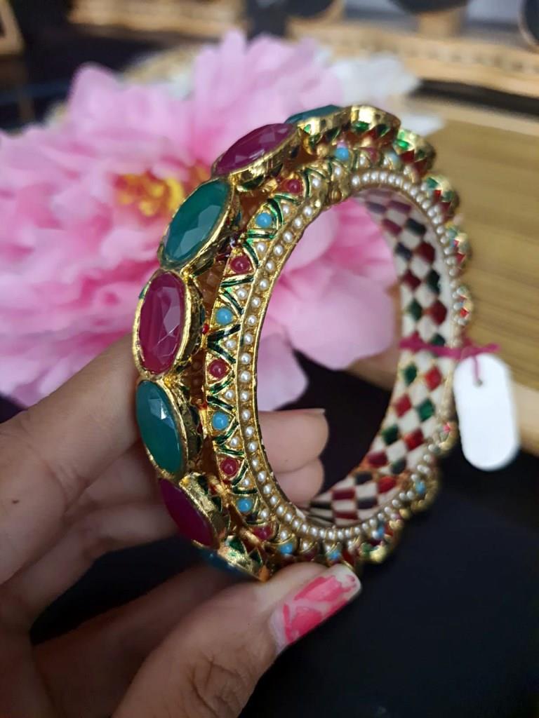 Gold Plated With Green And Ruby Stones.